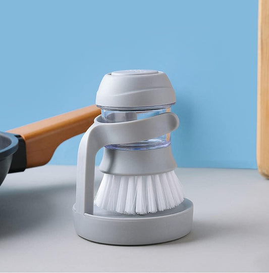 Cepillo de mano dispensador de jabon de cocina.