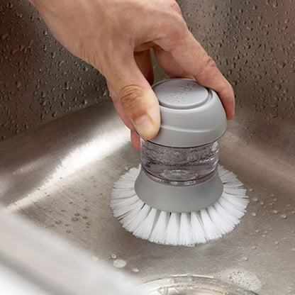 Cepillo de mano dispensador de jabon de cocina.